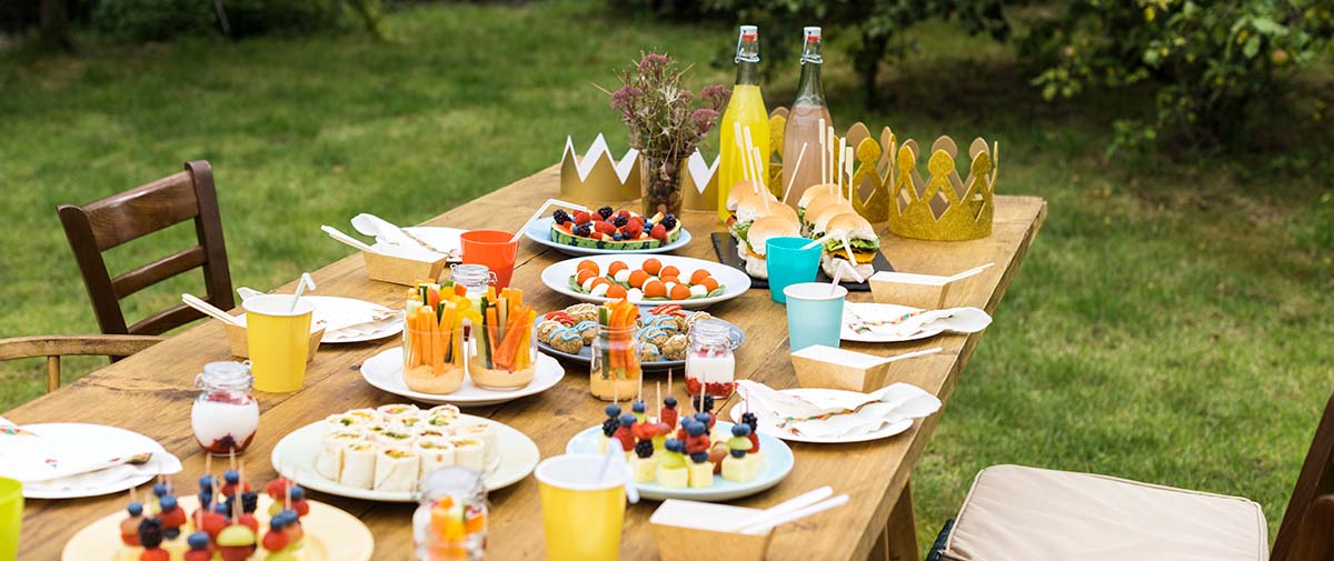 outdoor table with decorations and food